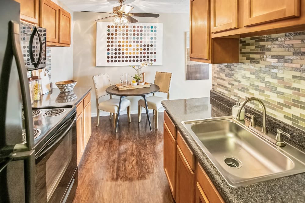 Kitchen with dining table at Solon Club Apartments in Oakwood Village, Ohio