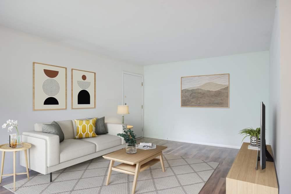 Minimalist Living Area with Wall Decors at Squires Manor Apartment Homes in South Park, Pennsylvania