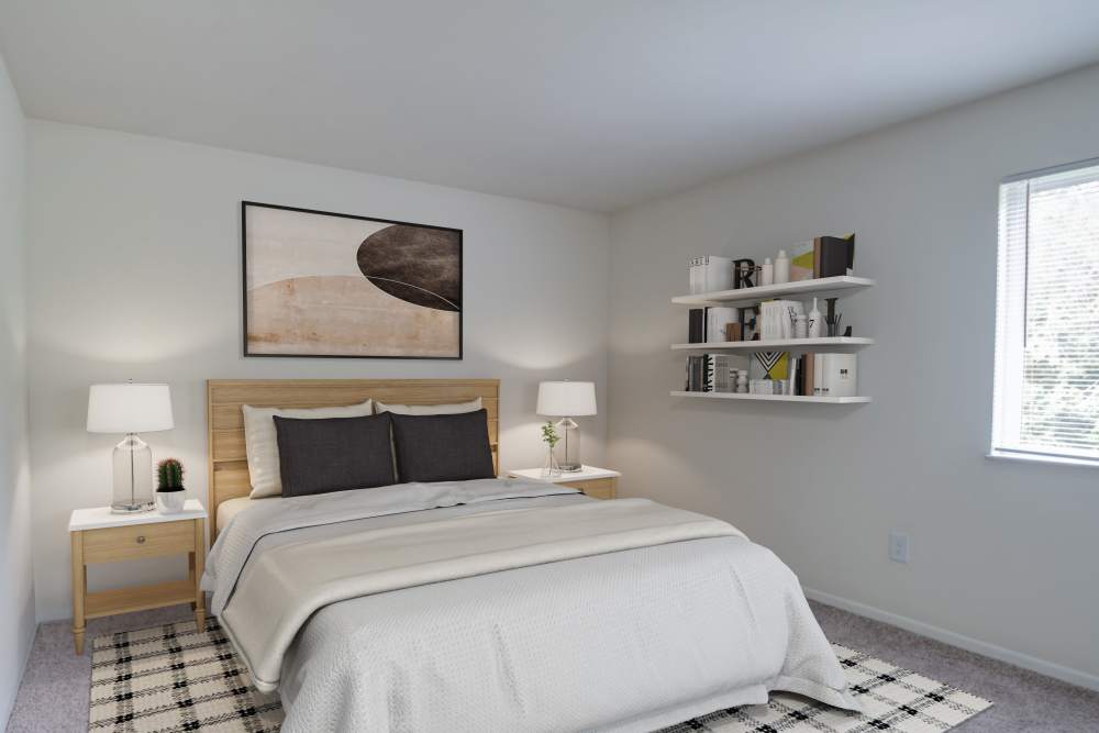Cozy Bedroom with Wood-Style Headboard at Squires Manor Apartment Homes in South Park, Pennsylvania
