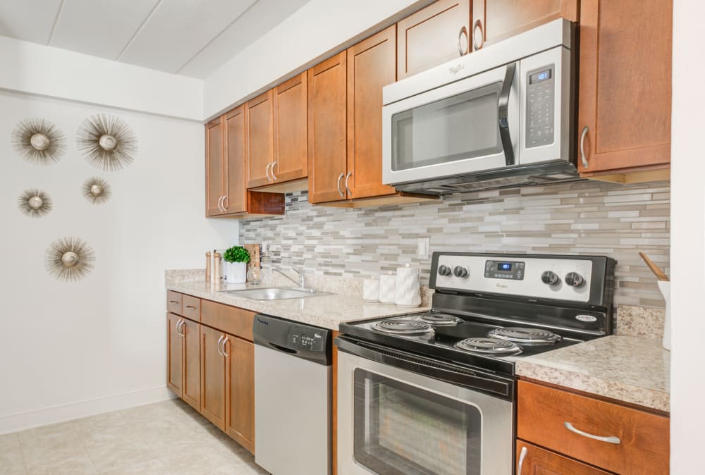 Kitchen with stainless steel appliances at Stonegate at Devon Apartments in Devon, Pennsylvania