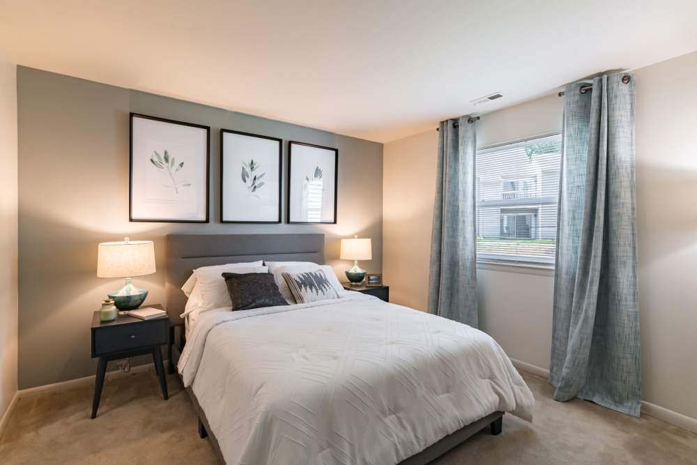 Model bedroom with plush carpeting at The Landings Apartment Homes in Absecon, New Jersey