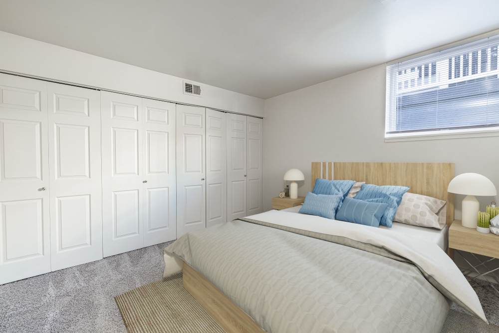 Model bedroom with lots of closet space at The Cascades Townhomes and Apartments in Pittsburgh, Pennsylvania