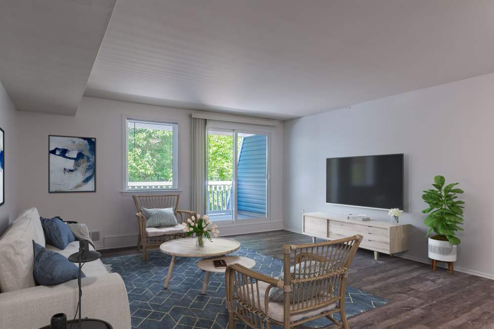Living room with sliding glass door to private balcony at The Cascades Townhomes and Apartments in Pittsburgh, Pennsylvania
