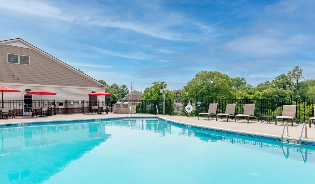 Pool area with lounge seating at in Aliquippa, Pennsylvania