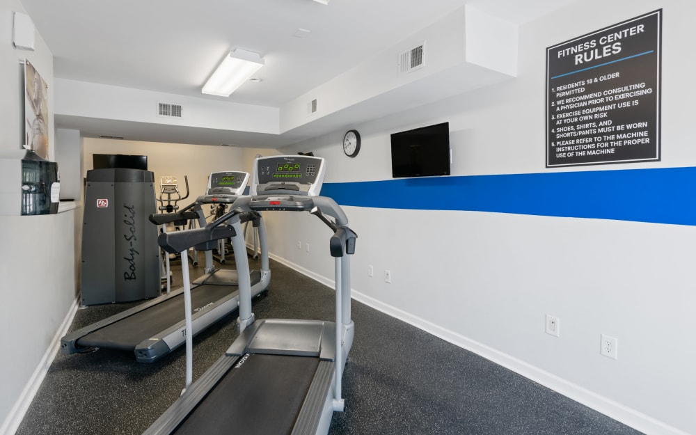 Well-equipped fitness center with cardio equipment at Mews at Annandale Townhomes in Annandale, New Jersey