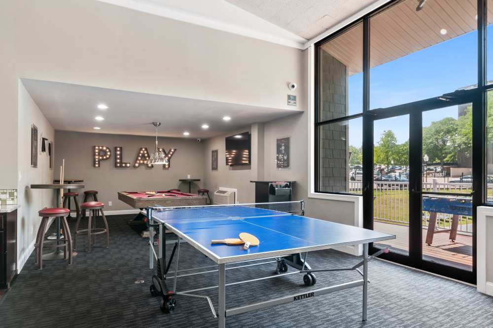Resident clubhouse with a kitchen and billiards at Timberlake Apartment Homes in East Norriton, Pennsylvania