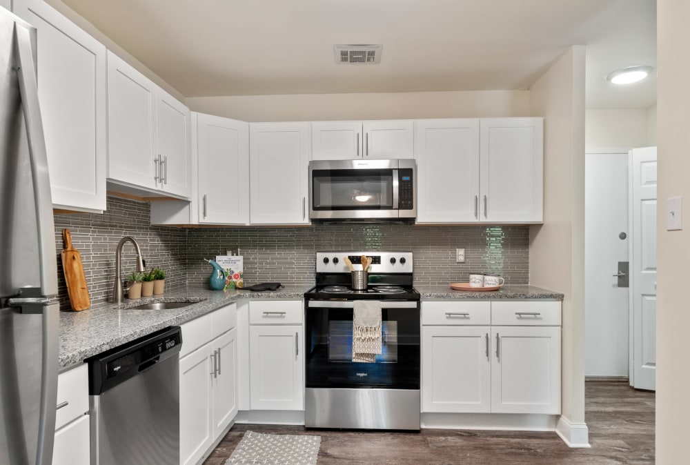 Modern kitchen with stainless steel appliances at Timberlake Apartment Homes in East Norriton, Pennsylvania