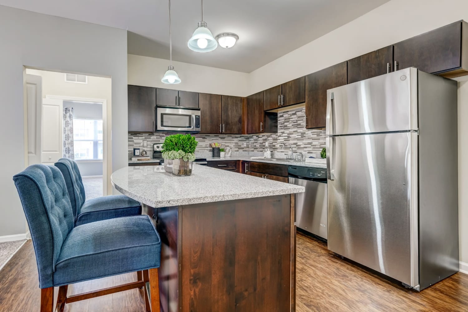 Gourmet kitchen with adaptable island at Torrente Apartment Homes in Upper St Clair, Pennsylvania