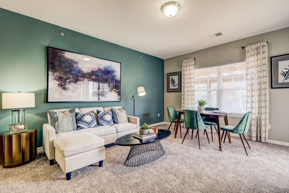Living room with an accent wall at Torrente Apartment Homes in Upper St Clair, Pennsylvania