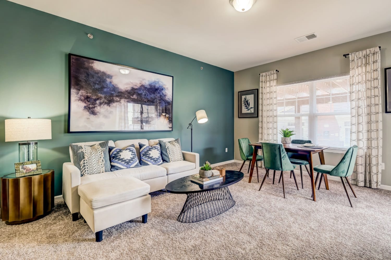 Living room with an accent wall at Torrente Apartment Homes in Upper St Clair, Pennsylvania