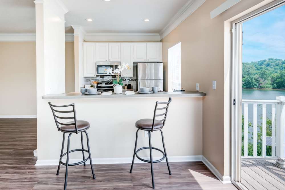 Contemporary kitchen with a breakfast bar at The Waterfront Apartments & Townhomes in Munhall, Pennsylvania