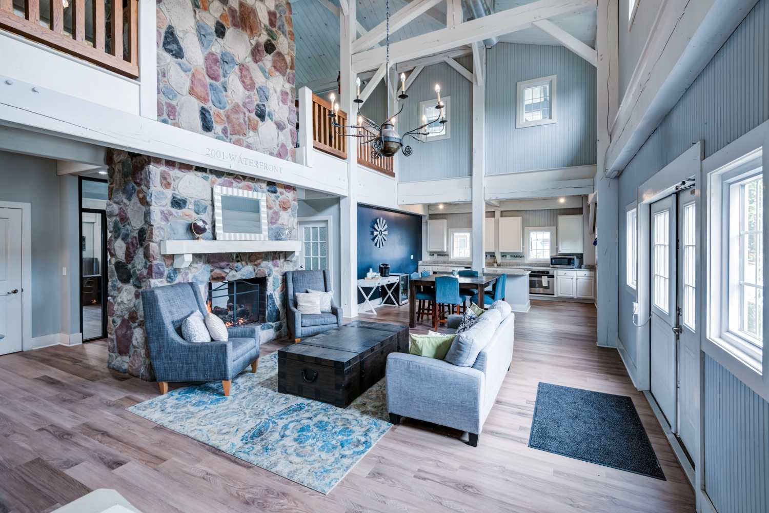Resident clubhouse with a beautiful stone fireplace at The Waterfront Apartments & Townhomes in Munhall, Pennsylvania