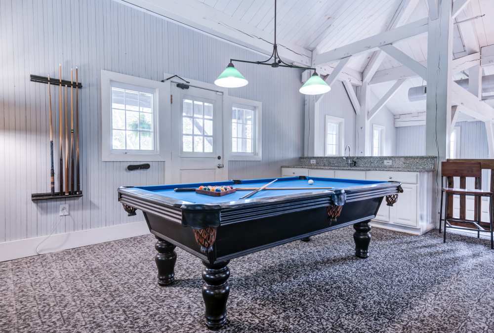 Game room with billiards at The Waterfront Apartments & Townhomes in Munhall, Pennsylvania