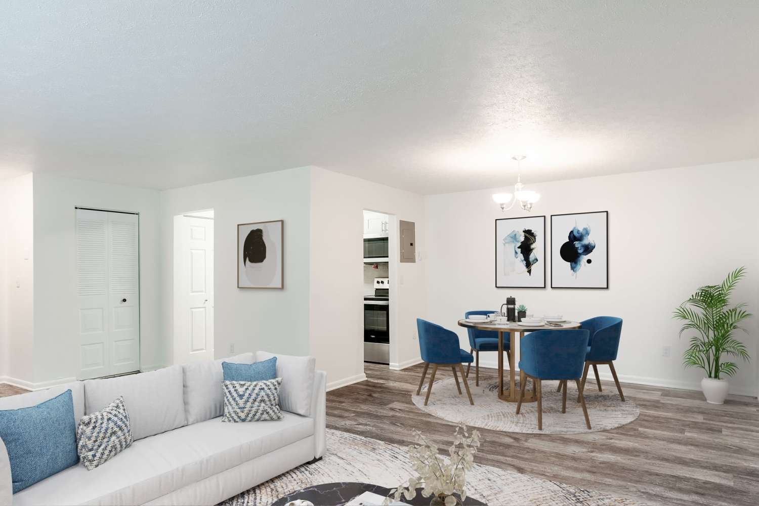 Spacious living room with wood-style flooring at Westpointe Apartments in Pittsburgh, Pennsylvania