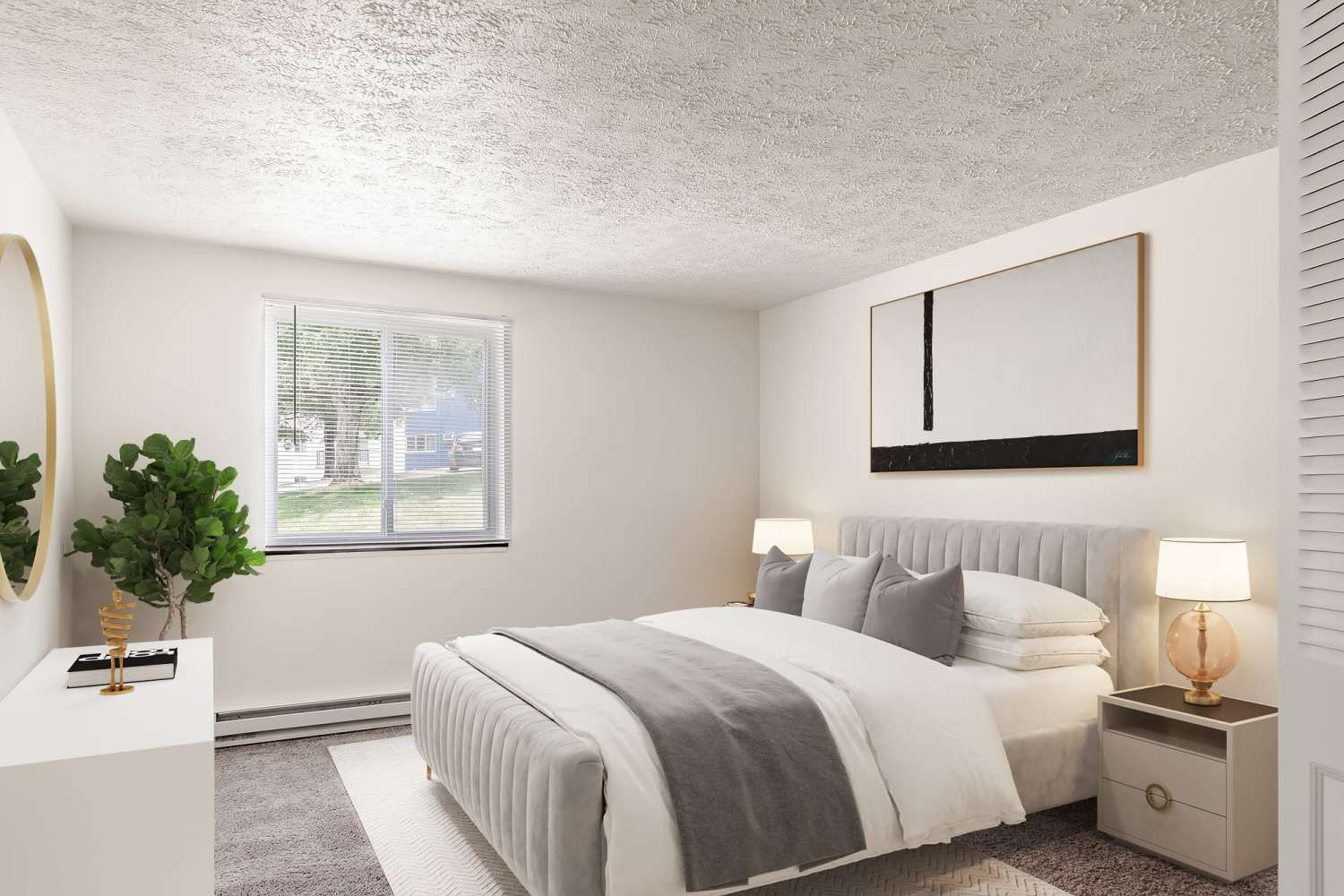 Apartment bedroom with bed lamp and comfortable bed at Westpointe Apartments in Pittsburgh, Pennsylvania