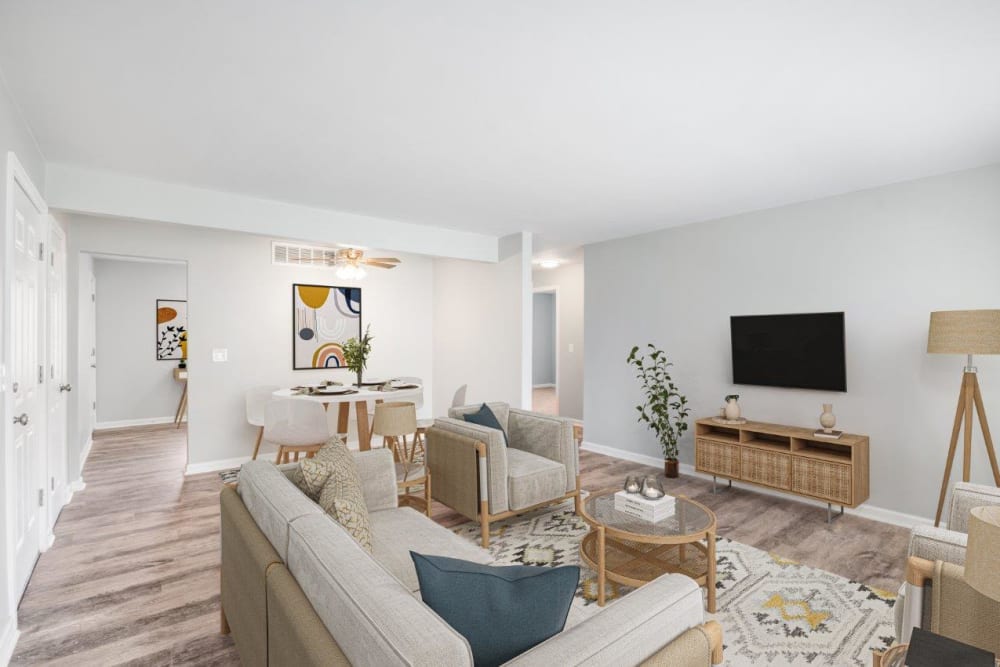 Staged living room and dining area at Woodcrest Apartment Homes in Dover, Delaware