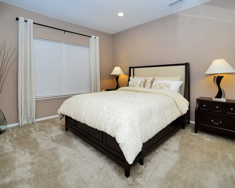 A bedroom in an apartment at Woodview at Marlton Apartment Homes in Marlton, New Jersey