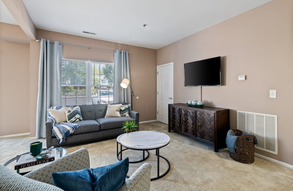 Modern living room and large window at Woodview at Marlton Apartment Homes in Marlton, New Jersey