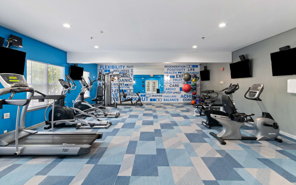 Well-equipped fitness center with cardio equipment at Woodview at Marlton Apartment Homes in Marlton, New Jersey