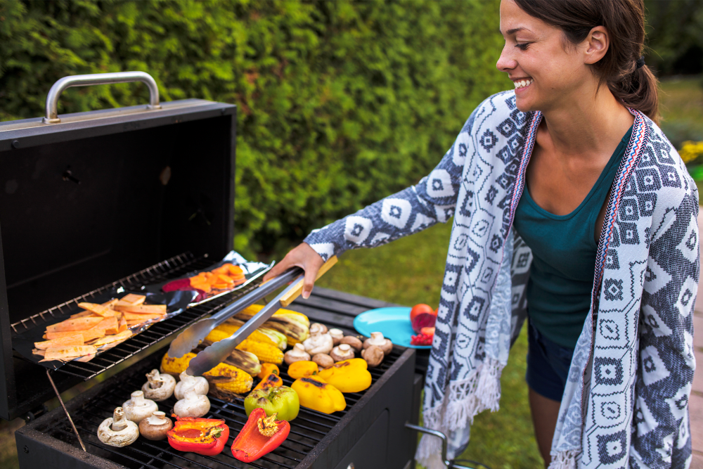 Outdoor resident grilling at Burnt Mill Apartment Homes in Voorhees, New Jersey