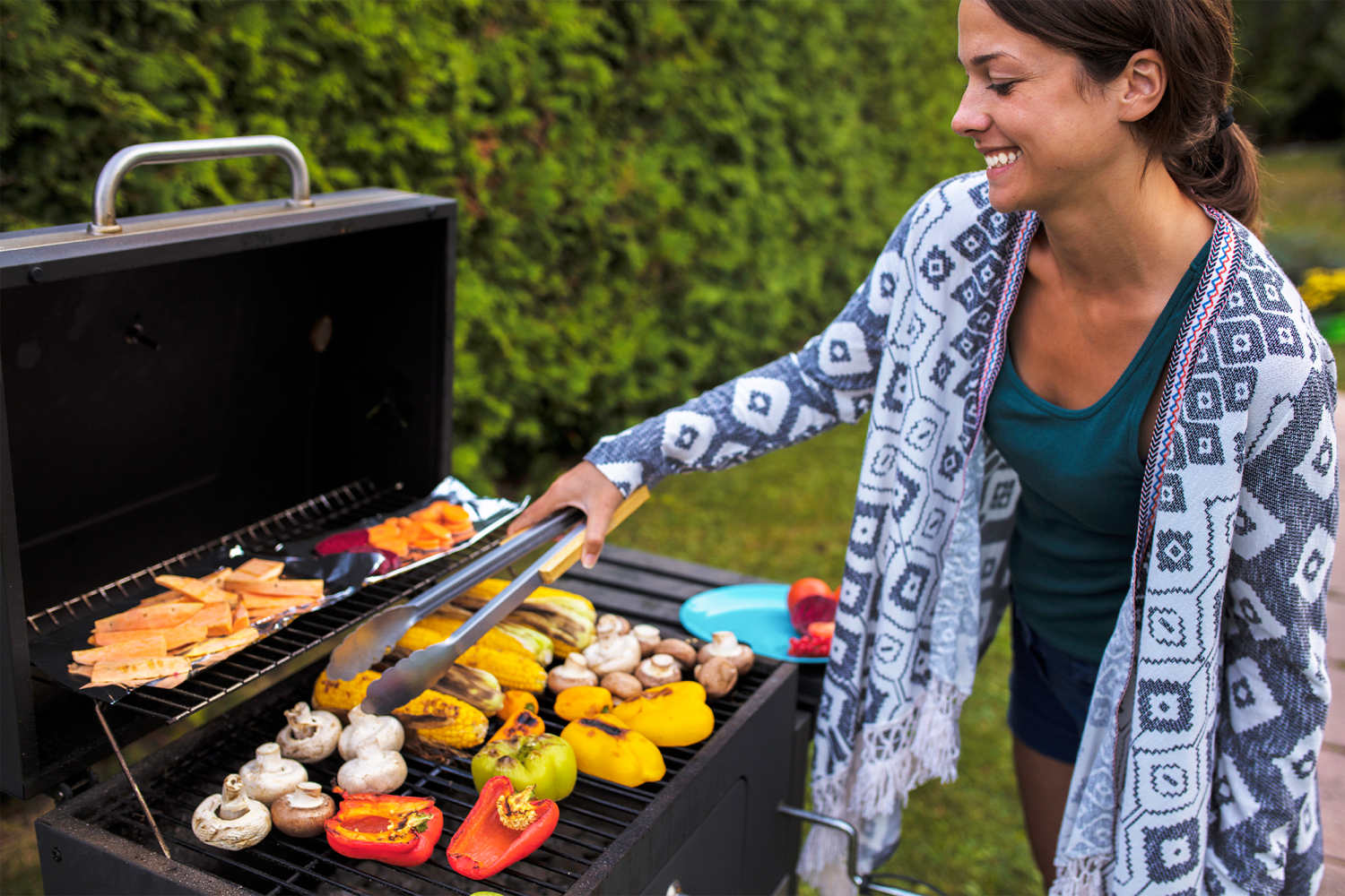 Resident grilling outdoors at Burnt Mill Apartment Homes in Voorhees, New Jersey