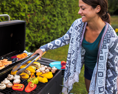 Resident Enjoying the Outdoor Grill at Greentree Village Townhomes in Lebanon, Pennsylvania