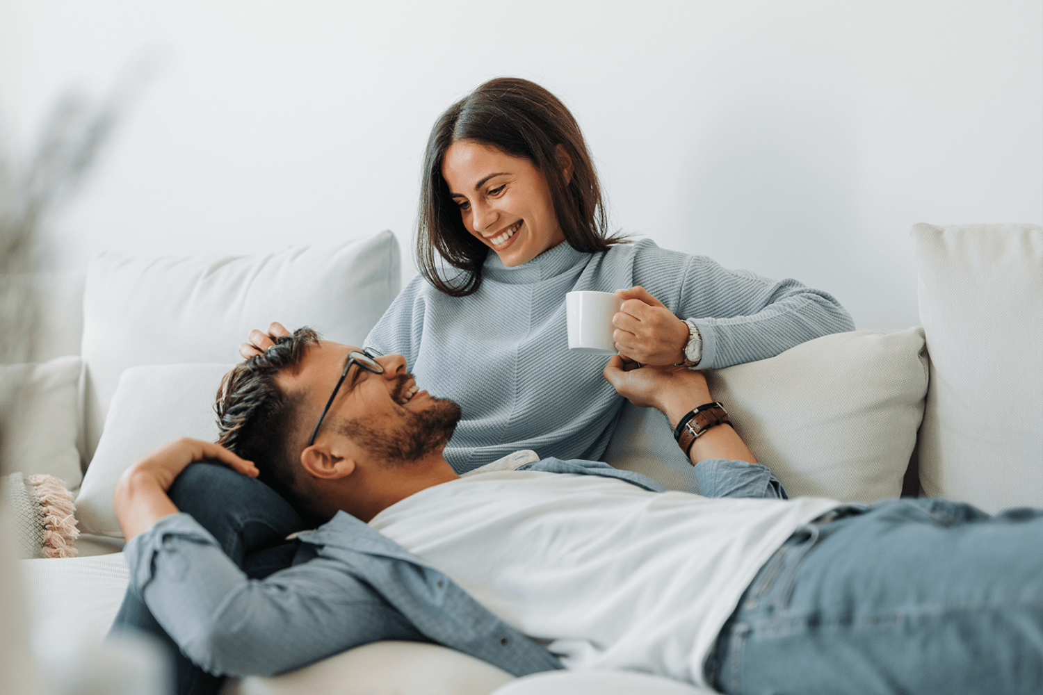 Couple relaxing in their new home at Country Village Apartment Homes in Dover, Delaware